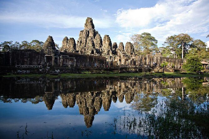 Angkor Wat Day Tours And Sunset - Banteay Kdei: monk cells, tree roots, and the Bayon ramp-up