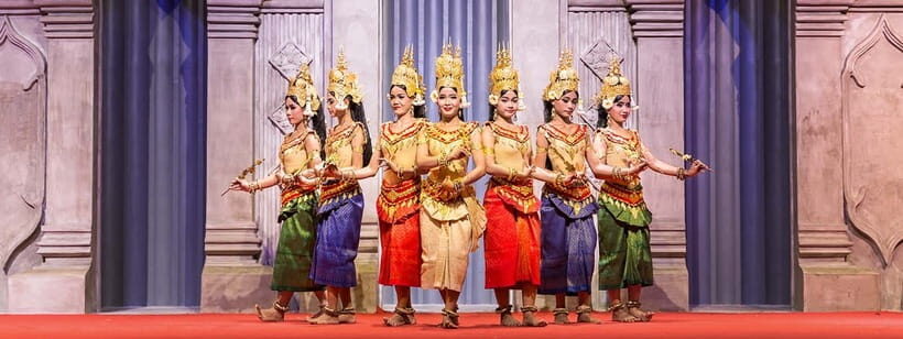 Apsara Dance Show with Dinner by Tuk-Tuk Roundtrip Transfer - Inside the venue: the curved stone stage, water, and flowers