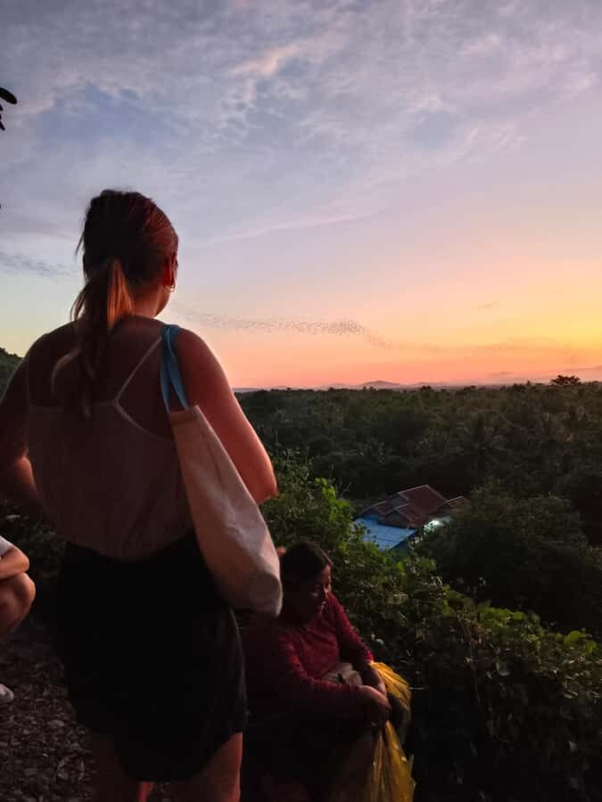 Battambang,Tuktuk and kayak, BambooTrain ,Wat Banan,Bat cave - Phnom Sompov: steps, scooter/jeep up, and Khmer Rouge-era caves