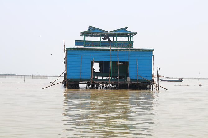 Guided Floating Village Boat Tour in Siem Reap - Boarding a traditional long-tail boat on UNESCO Tonle Sap Lake