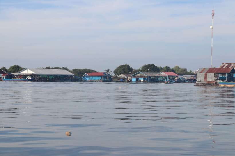 Kompong Khleang Floating Village: Full-Day from Siem Reap - Floating school visit: handing out supplies the right way
