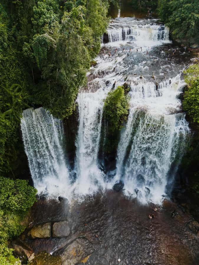 Kulen Waterfall: Rise and Shine with Cliff, Village w/ Guide - Village stop and sugar palm cake: the small moments that make it feel real