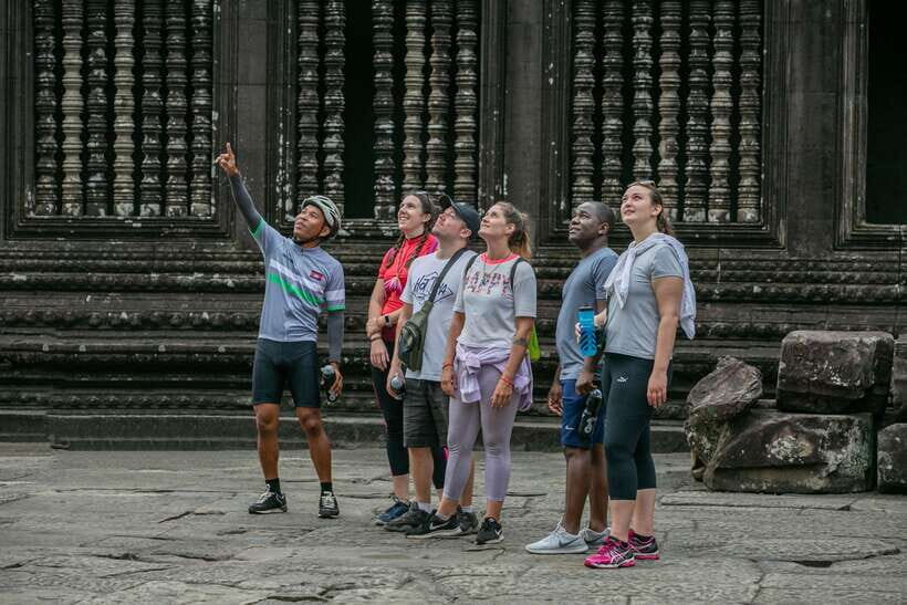Siem Reap: Angkor Sunrise 2 Days Guided Bike Tour - Riding Behind Angkor Wat: Jungle Trails and Local Daily Life