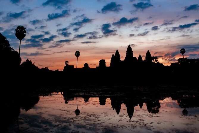 The Angkor Temples from Sunrise by Tuk Tuk - Angkor Thom and Bayon: moving from grand gates to Khmer faces